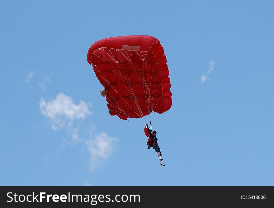 Parachuter on the blue sky