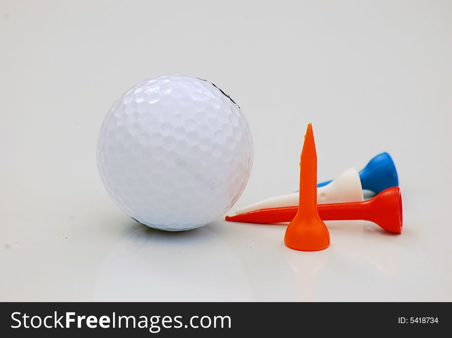 Shot of a golf ball and tees isolated