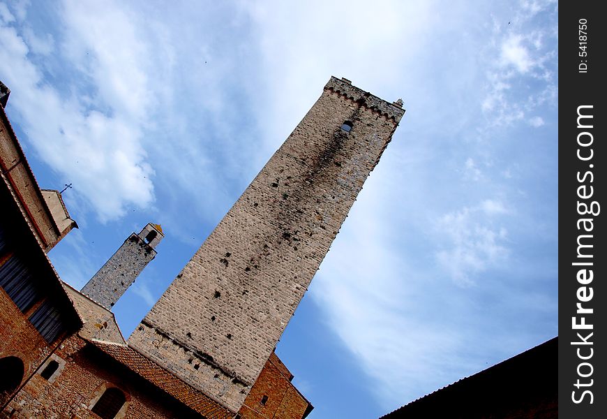 A spectacular shot of an ancient tower in San Gimignano under a spectacular sky. A spectacular shot of an ancient tower in San Gimignano under a spectacular sky