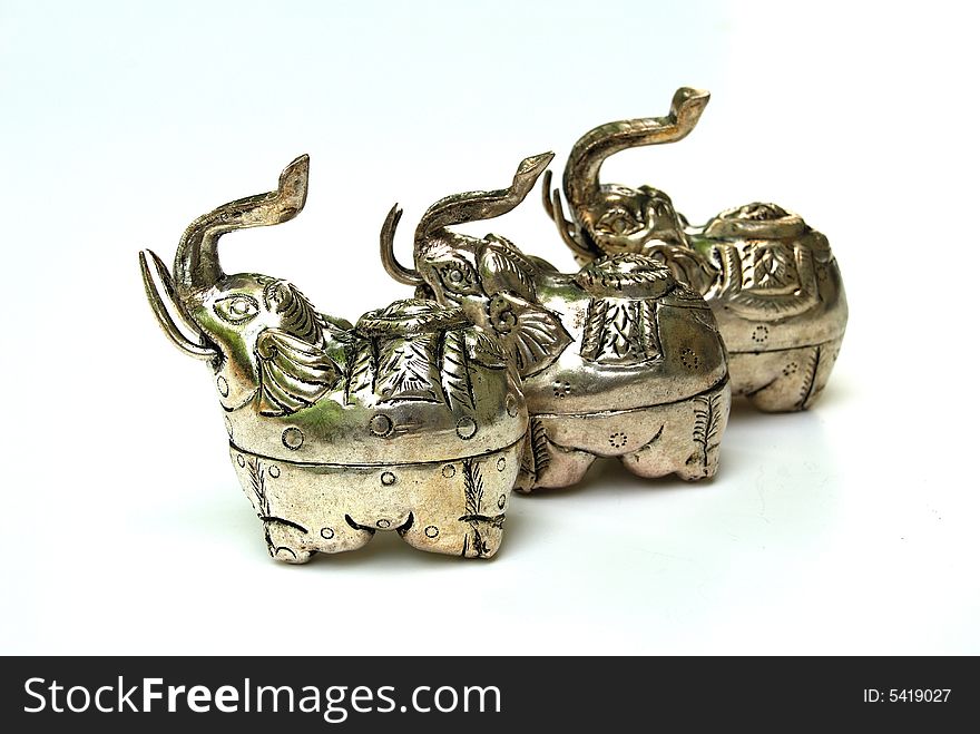 Handmade elephant silver boxes from Asia. Silver is a soft metal that has been used for many thousands of years by people all over the world, for jewelery, as money, and many other things. It is called a white metal even though it looks gray. The word silver is also used to talk about this colour or shade of gray.Silver is very malleable, and ductile, which means it can be pulled into wire or hammered into thin sheets. When it is used in money or in jewelery, it is often mixed with gold or some other metal to make it harder.