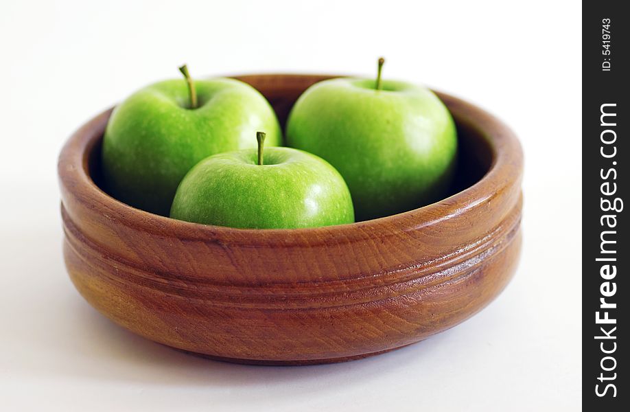 Three green apples in a bowl. Three green apples in a bowl