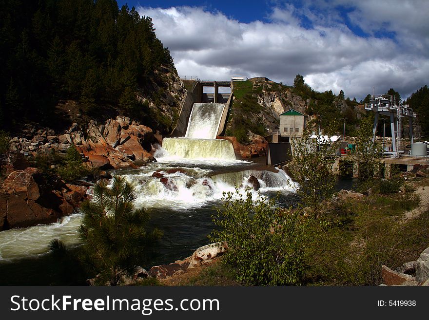 Open spillway and power plant at Cascade Dam, Cascade Idaho. Open spillway and power plant at Cascade Dam, Cascade Idaho