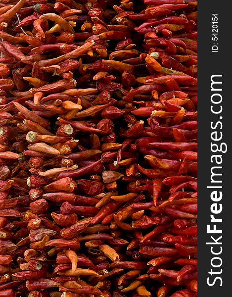 Strings of dried red chillies at the Turgutreis Market in Bodrum, Turkey