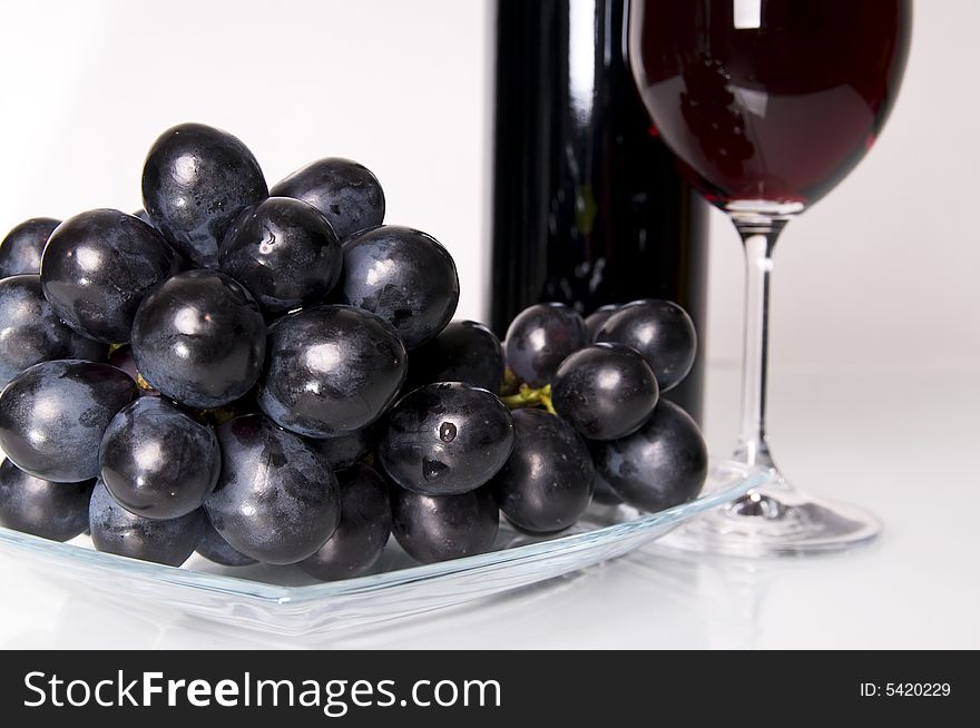 Glass of red wine and grapes. Glass of red wine and grapes.