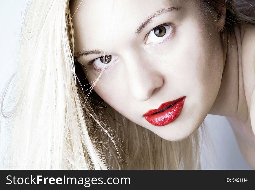 Sensual woman with red lips and blond long hair