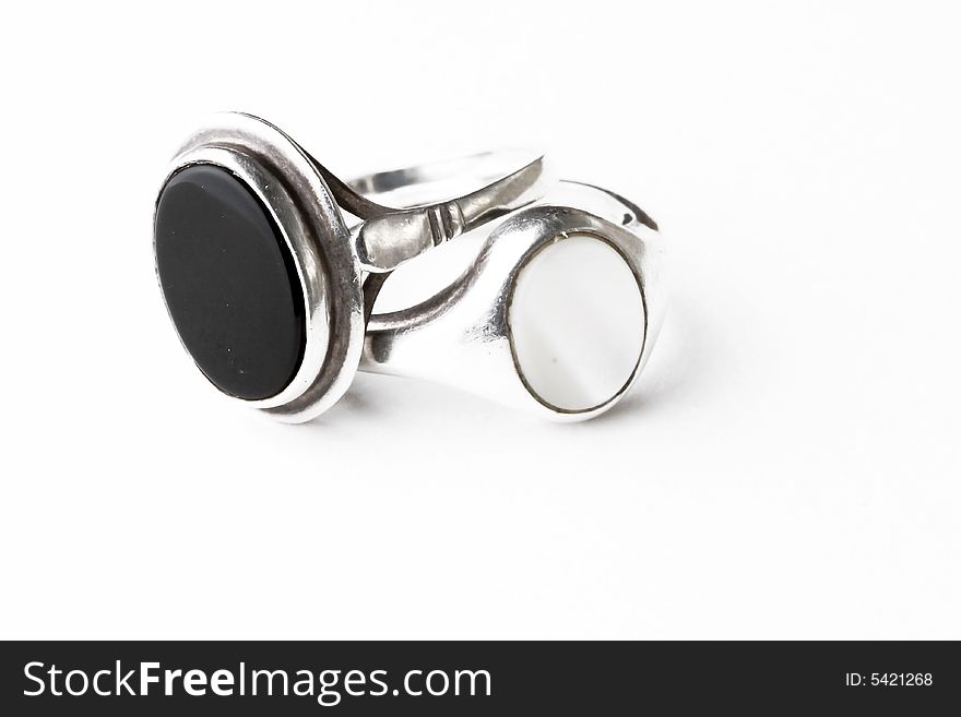 Two silver rings with precious stones isolated on white. Two silver rings with precious stones isolated on white