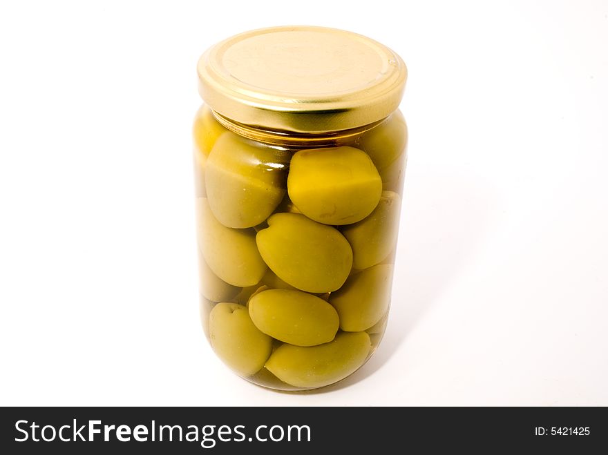 Bottle of green olives, close-up, over white background. Bottle of green olives, close-up, over white background