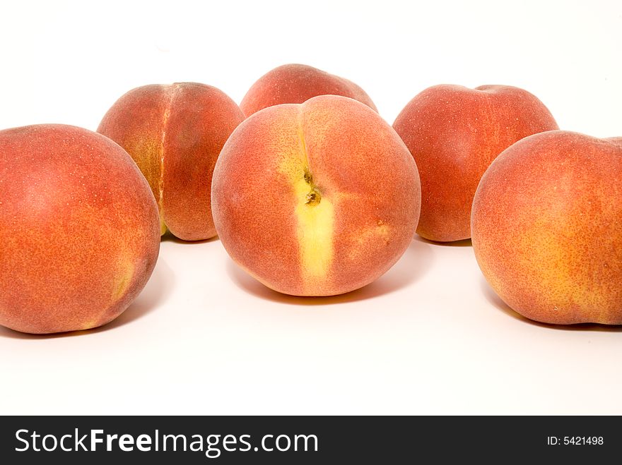 Still-life with peaches, placed over white