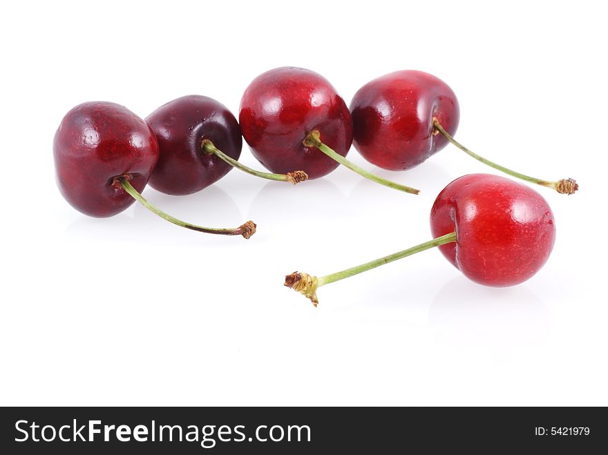 Five cherries isolated on a white background. Five cherries isolated on a white background.