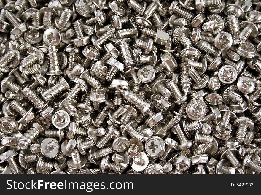 Shiny computer screws for hardware background. Shiny computer screws for hardware background