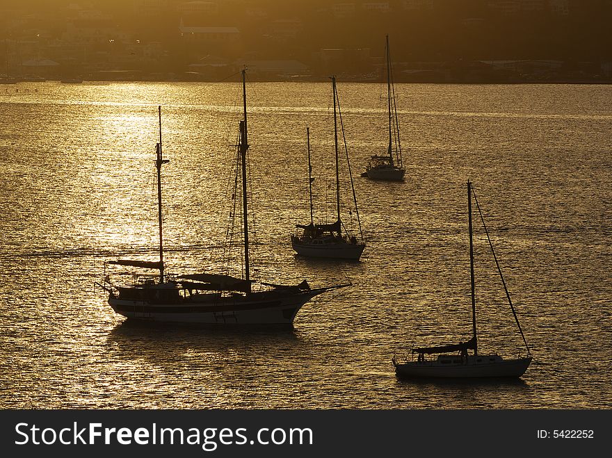 Yachts in St.Thomas island bay filled with sunset light (U.S. Virgin Islands). Yachts in St.Thomas island bay filled with sunset light (U.S. Virgin Islands).