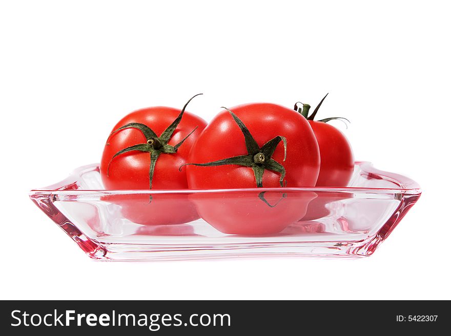 Tomatoes On A Glass Plate.