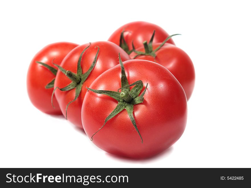 Red tomatoes isolated on white background. Red tomatoes isolated on white background.