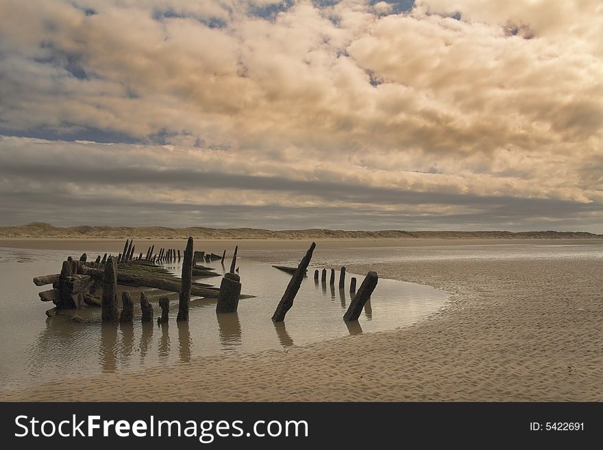 Historic shipwreck on Ainsdale Beach in England. Three masted timber baque.