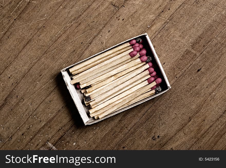 Matchbox on old table, closeup shot. Matchbox on old table, closeup shot.