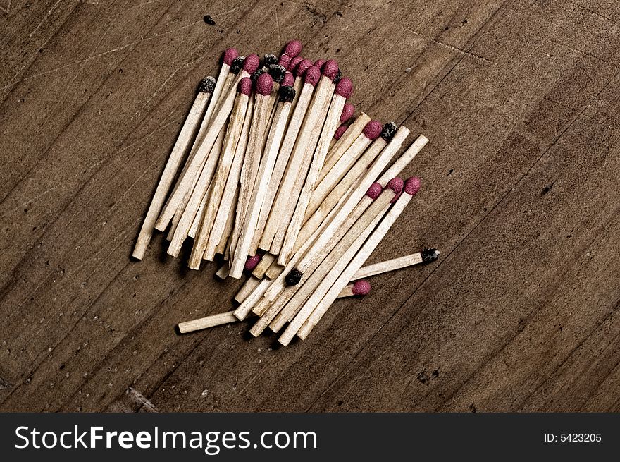 Matches on old table, closeup shot. Matches on old table, closeup shot.