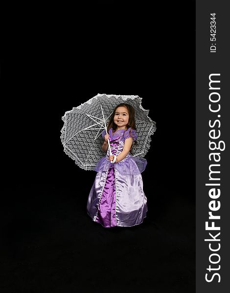 Pretty little girl in a purple satin dress and a white parasol. Pretty little girl in a purple satin dress and a white parasol.