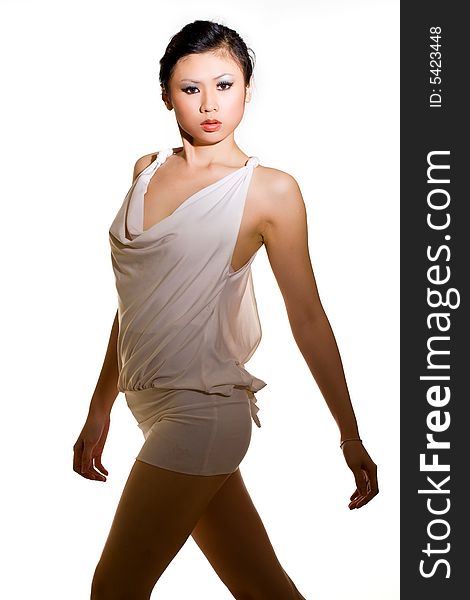 Asian young woman in sexy white short dress posing. Asian young woman in sexy white short dress posing