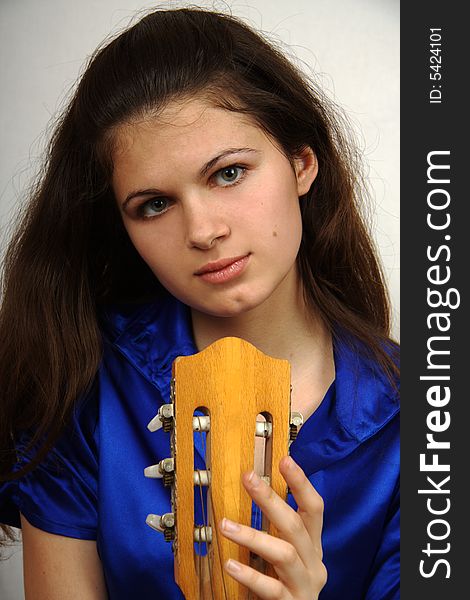 Girl with guitar looking in camera