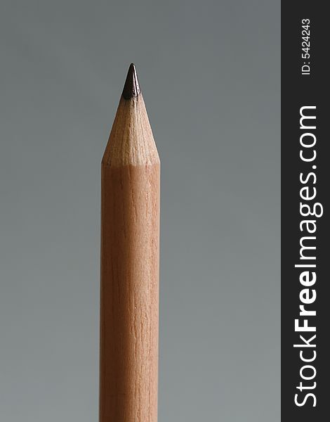 A pencil  with a simple blue color background. A pencil  with a simple blue color background
