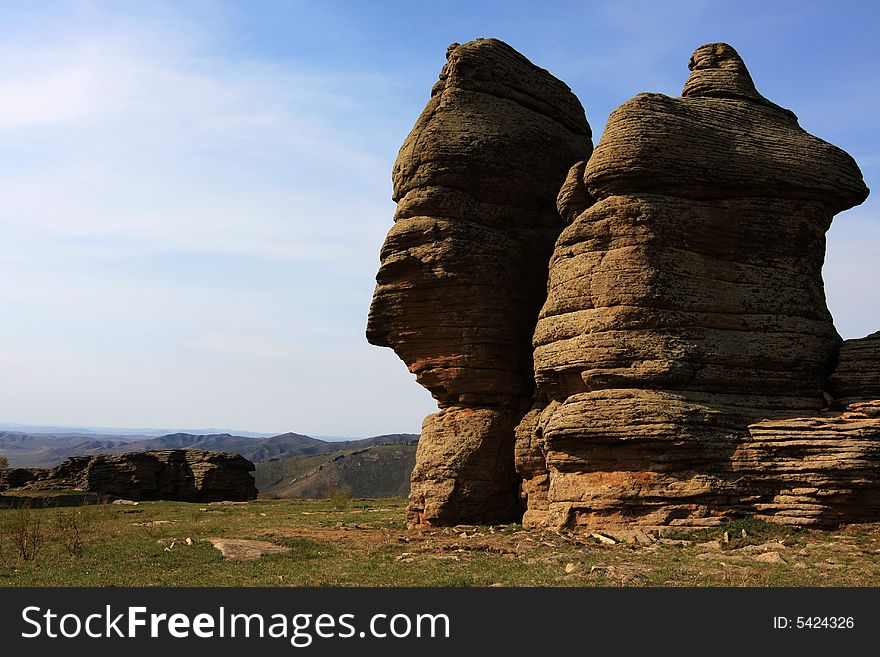 This is the stone forest in Keshiketeng Banner, inner-mongolia china. In each hill, there are many bits and pieces of stones on it. This is the stone forest in Keshiketeng Banner, inner-mongolia china. In each hill, there are many bits and pieces of stones on it.