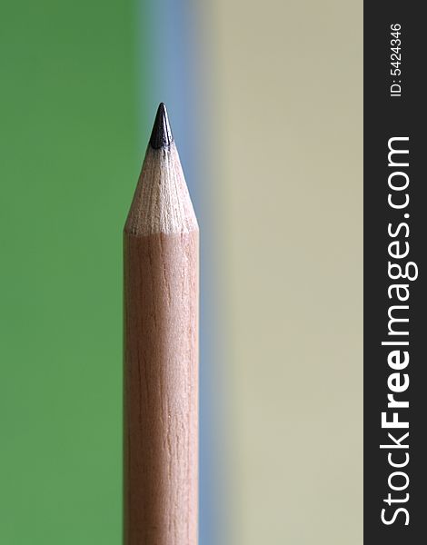 A pencil  with a simple colorful background. A pencil  with a simple colorful background