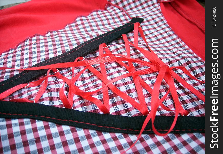 Red shirt-waist with cells and red lacing. Red shirt-waist with cells and red lacing