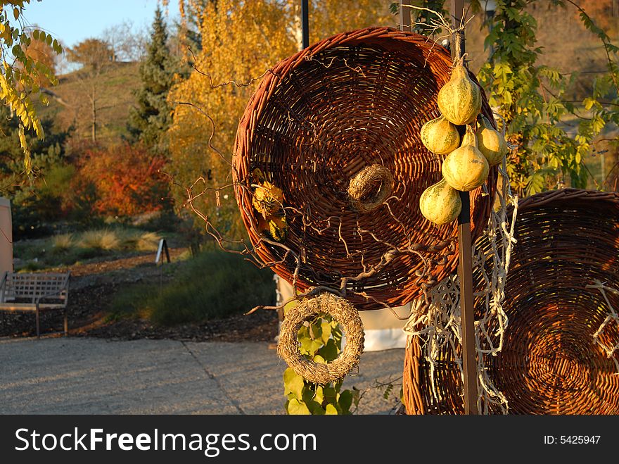 Pumpkin are on the hitch somewhere in the garden. Next the pumpkin are two baskets and some decorations.