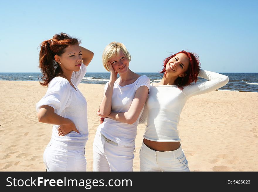 Three cute girls relaxing on the beach. Three cute girls relaxing on the beach