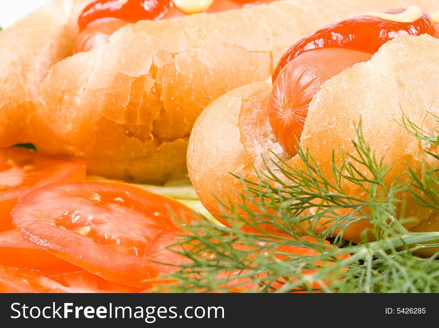 Hot dogs with vegetables isolated on a white background