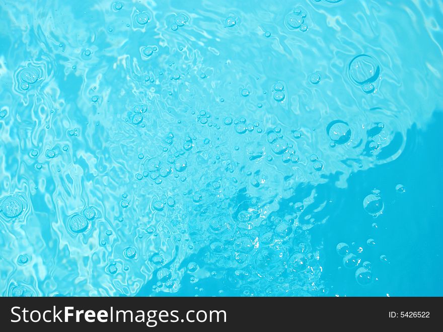 Flowing bubbles in pool water. Flowing bubbles in pool water