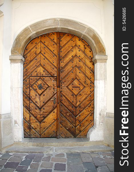 Old oak door with carved stone surround