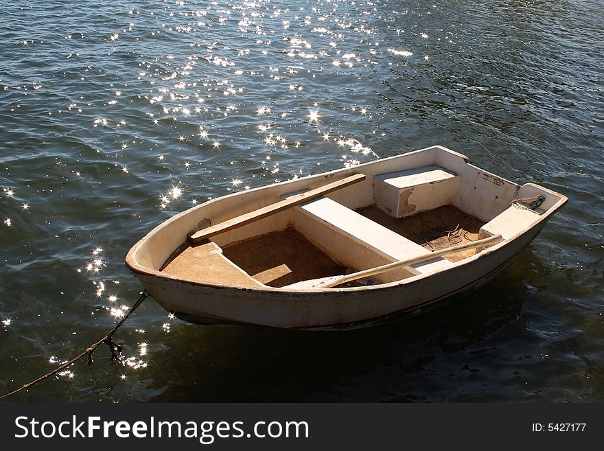 Small boat tied to a dock in the Caribbean. Small boat tied to a dock in the Caribbean