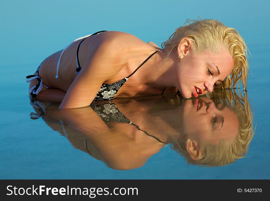 Portrait beautiful young woman in wather and reflection. Portrait beautiful young woman in wather and reflection.