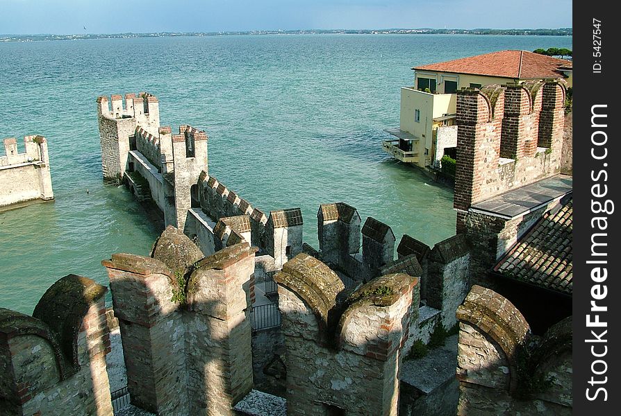 Medieval on a bank of lake, italy. Medieval on a bank of lake, italy
