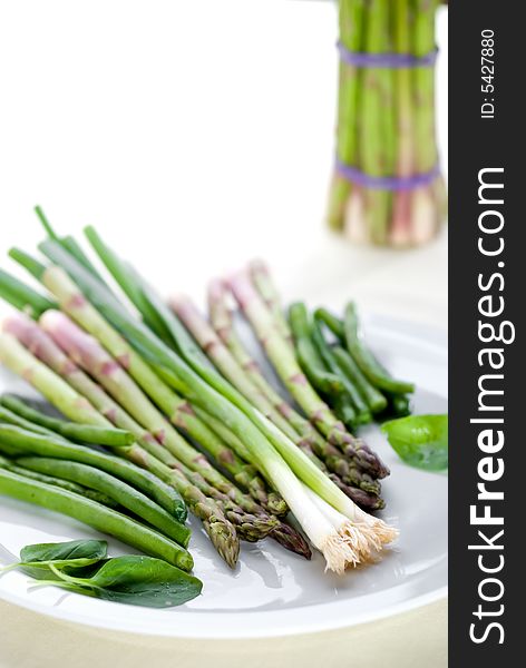 High key image of vegetables on a plate with shallow focus. High key image of vegetables on a plate with shallow focus