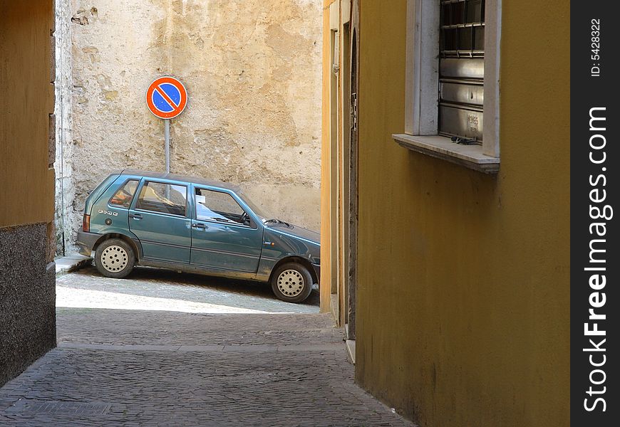 Parked car on narrow italian street