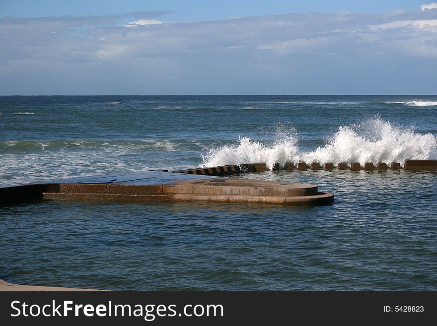 Swimming Pool connceted to the ocean at high tide. Swimming Pool connceted to the ocean at high tide