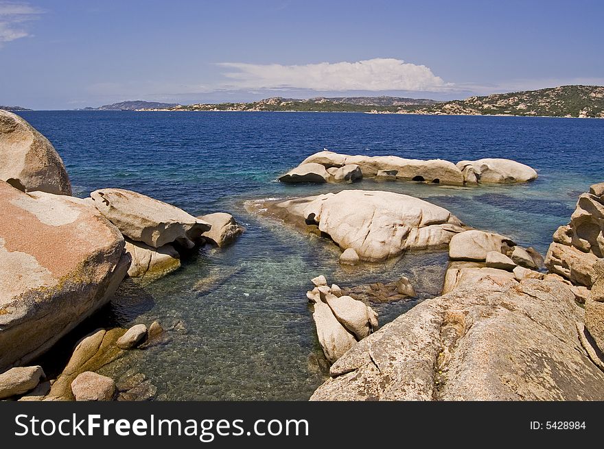 A shot of sardinian sea with rock near Santa Teresa Gallura. A shot of sardinian sea with rock near Santa Teresa Gallura.