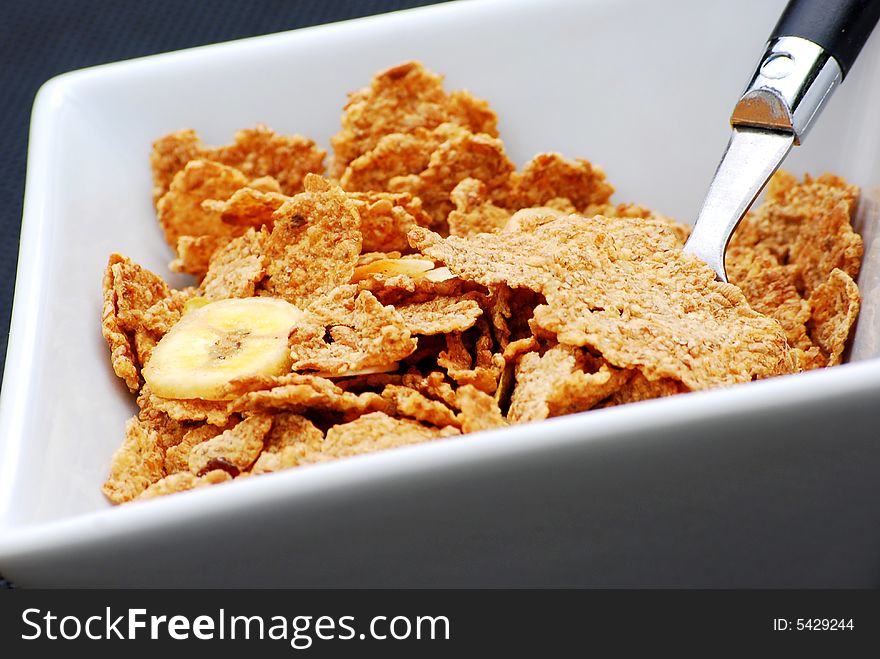 Close up shot of some healthy breakfast cereal with fruit and nuts