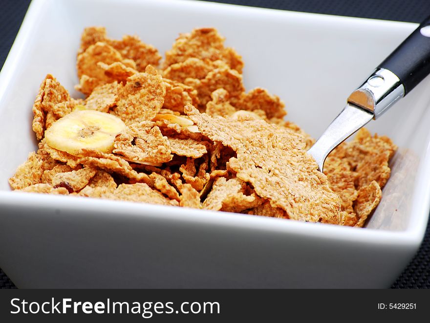 Close up shot of some healthy breakfast cereal with fruit and nuts