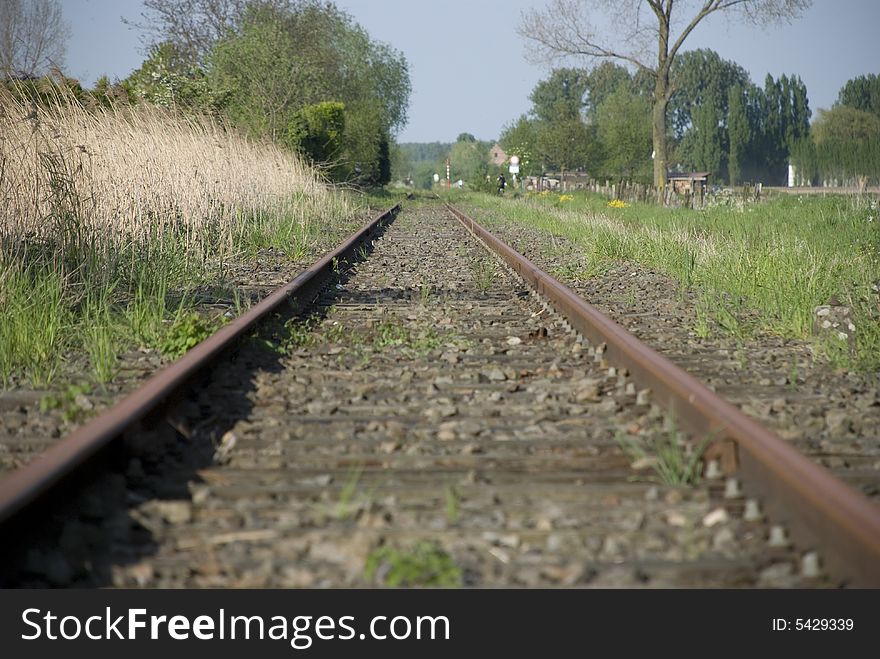 Old railway tracks with wooden crosses that are no longer in use. Old railway tracks with wooden crosses that are no longer in use.