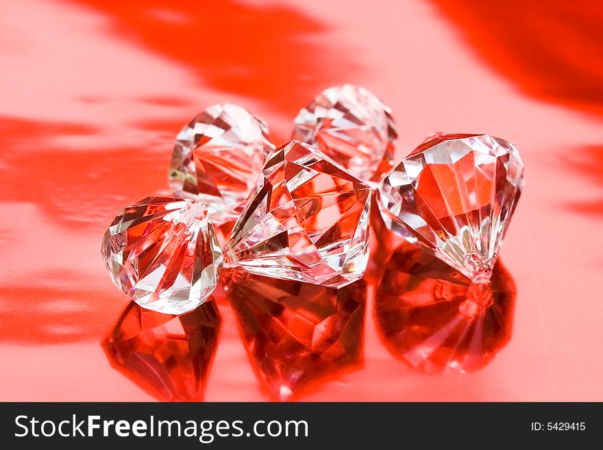 Beautiful diamond crystals on red background