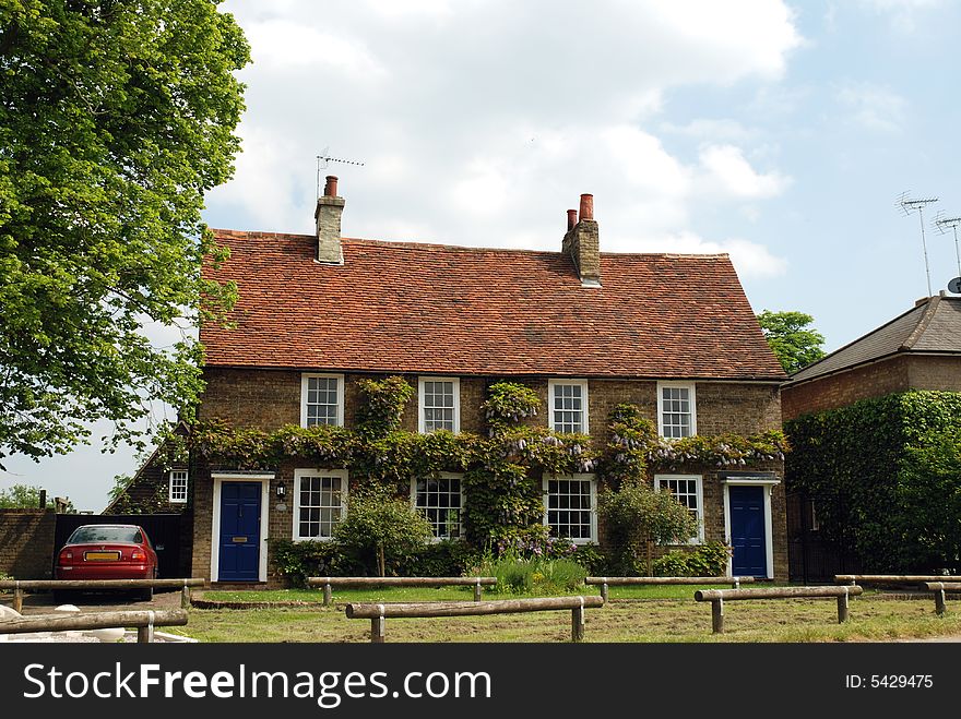 Pretty English cottages on a village green