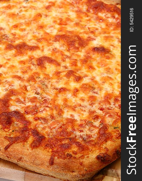Fresh baked cheese bread pizza close up. Fresh baked cheese bread pizza close up.