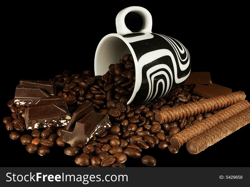 Isolate coffee beans, cup and bars of chocolate against white. Isolate coffee beans, cup and bars of chocolate against white