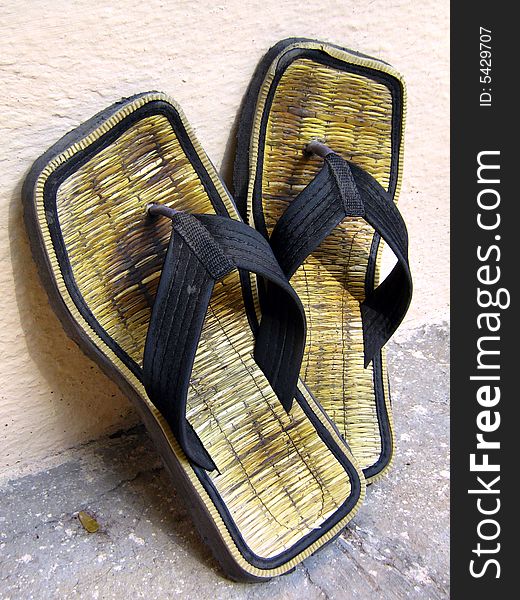 A pair of comfortable wooden material slippers. A pair of comfortable wooden material slippers