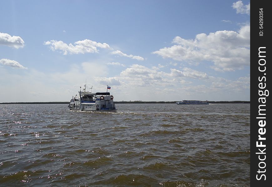 Riverboat on the vast expanse of the river. Riverboat on the vast expanse of the river.