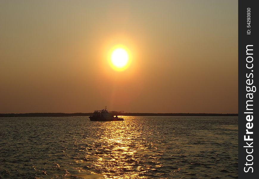 Riverboat on the vast expanse of the river. Riverboat on the vast expanse of the river.