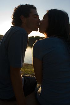 Couple Kissing At Sunset-Vertical Stock Photos Couple Kissing At Sunset-Vertical Stock Photos